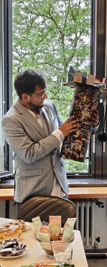 Arghyadeep Basu in a grey suit